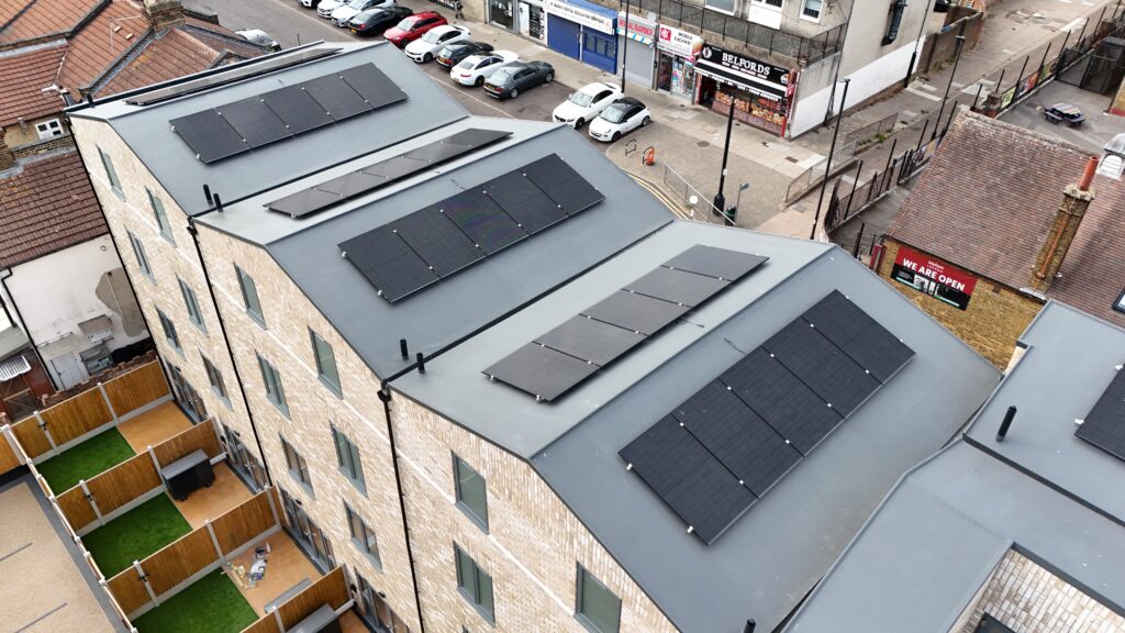 Solar arrays and rooflights viewed from above at Main Avenue, Enfield