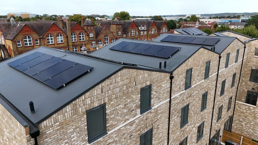 Oblique aerial view of roof-mounted solar panels at Main Avenue, Enfield
