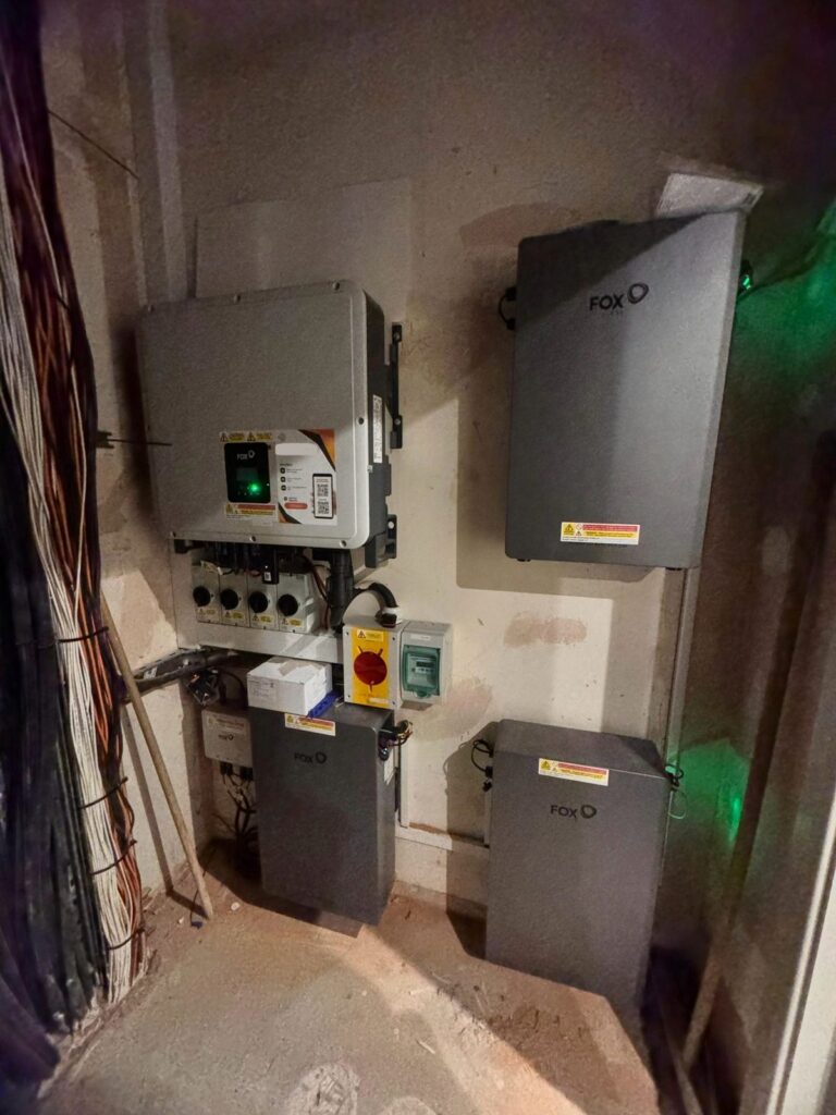 Fox ESS inverter, isolators and battery units in a plant room
