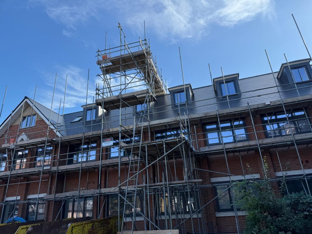 Scaffolding up the side of a residential block during the build